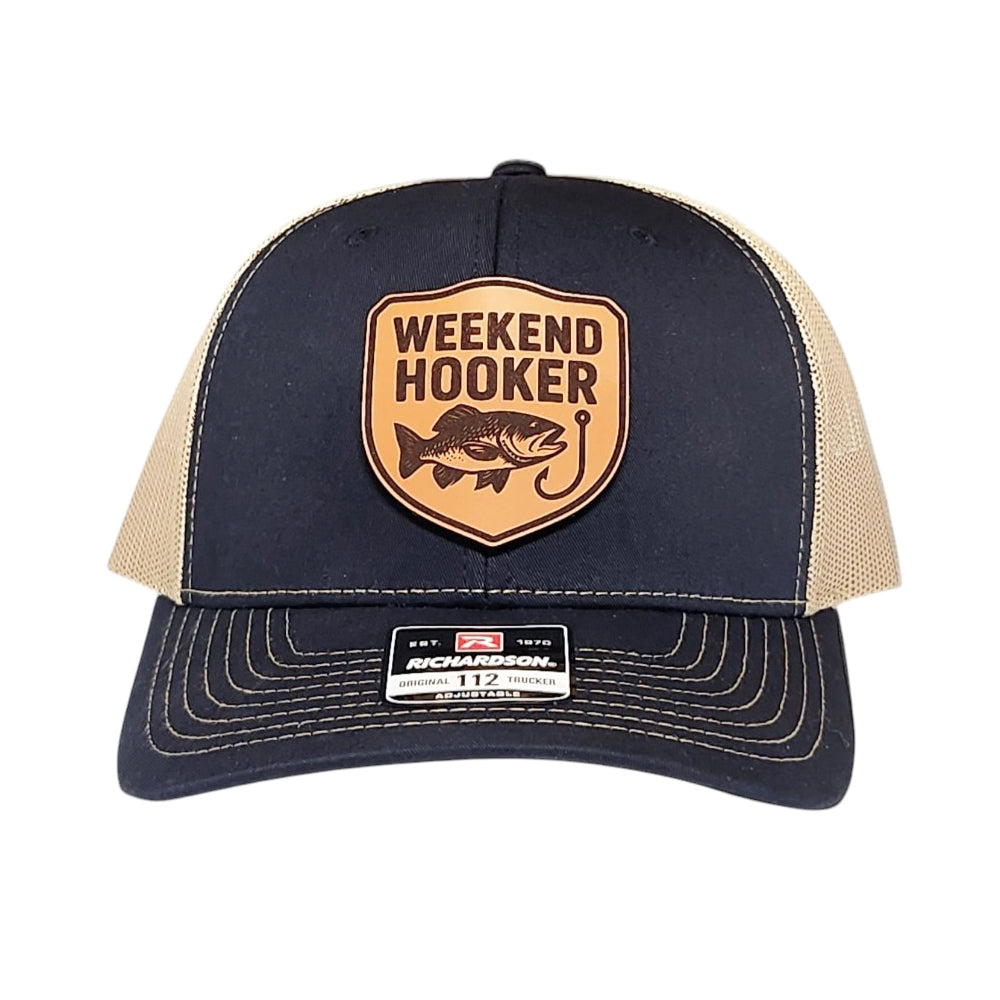 Navy and beige cap with 'Weekend Hooker' logo on a white background